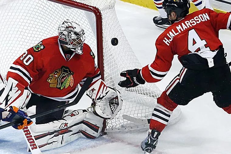 The Flyers may try to bring back goaltender Ray Emery, who's now with the Blackhawks. (Charles Rex Arbogast/AP)