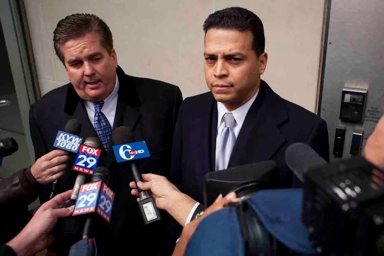 Former Phila. Police Inspector Daniel Castro (right) with attorney William Brennan outside the federal courthouse in November.