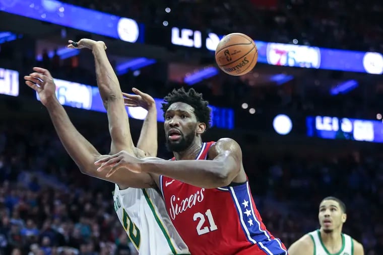 Sixers' Joel Embiid reacts to a no call foul by Celtics' Al Horford during the 4th quarter at the Wells Fargo Center in Philadelphia, Tuesday, February 12, 2019. Celtic brat the Sixers   112-109.