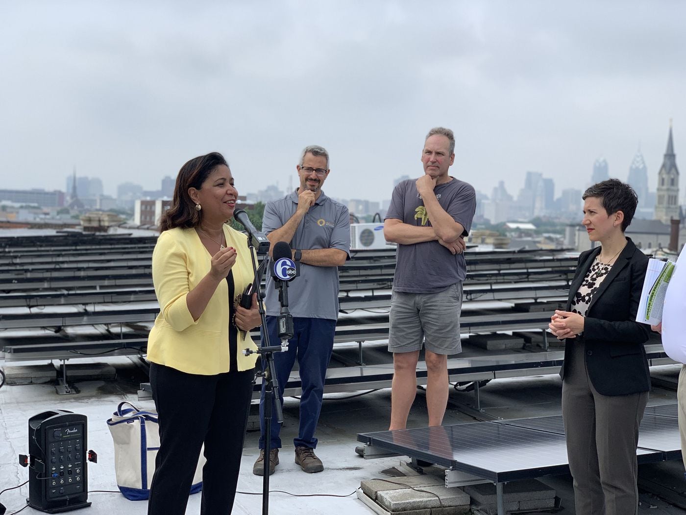 Councilwoman Maria Quiñones-Sanchez gathered with clean energy officials on the top of the Crane Arts Building, which has its roof covered in solar panels, to discuss the recent report detailing Pennsylvania's clean energy job growth, on Tuesday, June 18. 