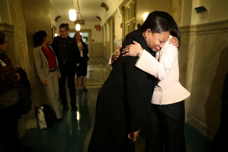 Tenant Laron Campbell had eviction proceedings initiated against her when she withheld rent because, she alleges, her landlord would not make necessary repairs. She was represented by Community Legal Services in court, and the case was ultimately withdrawn. Here, she hugs Councilmember Helen Gym after Philadelphia's Right to Counsel bill passed out of a City Council committee in October.