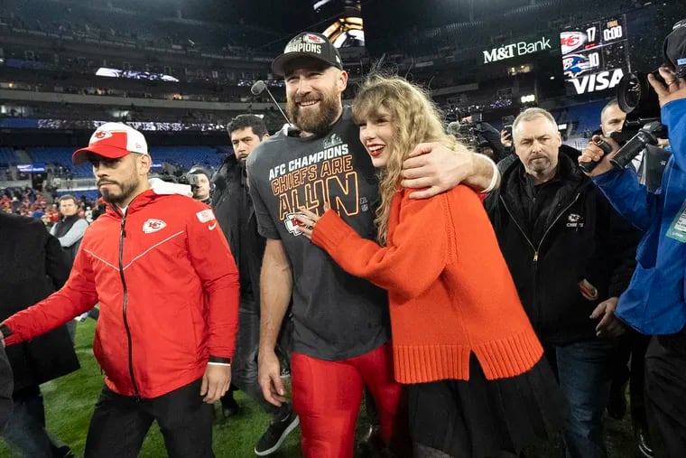 Kansas City Chiefs tight end Travis Kelce embraces Taylor Swift after the Kansas City Chiefs won the 2024 AFC Championship against the Baltimore Ravens in February. The couple recently went on vacation in Carmel-by-the-Sea, Calif., with Bradley Cooper and Gigi Hadid, who also have connections to the Philadelphia area.
