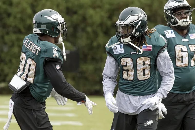 Newly acquired Eagles running back Jay Ajayi (right) looking to Corey Clement during his first practice with the Eagles at the NovaCare Complex on Nov. 1.