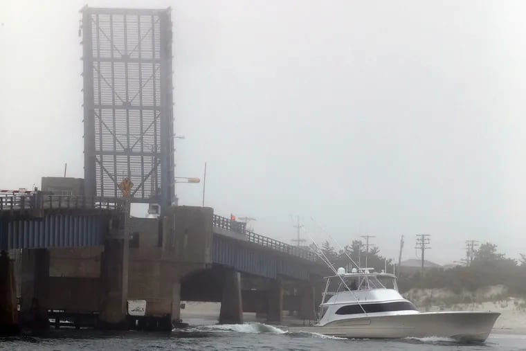 A motor yacht passes through the open Townsends Inlet Drawbridge last year.