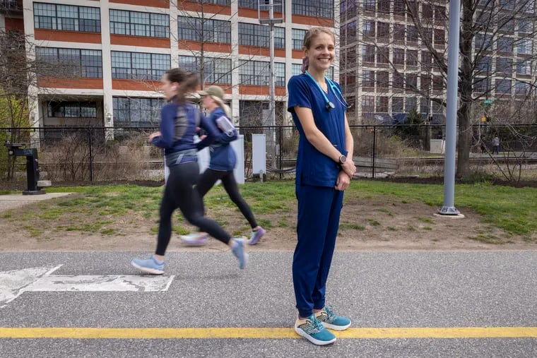 Penn nurse Sam Roecker ran the Boston Marathon in hospital scrubs, which she showed off earlier this month on the Schuylkill River Trail.
