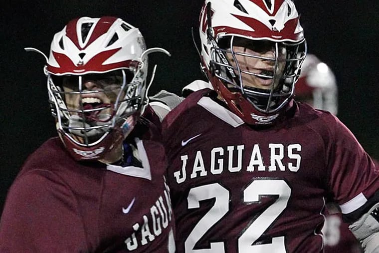 Garnet Valley's Matt Taulane, left, celebrates with Brandon Down after his
winning OT goal against Radnor in District I Semi-Finals at Radnor
High School on Tuesday, May 21.  (Ron Cortes/Staff Photographer)