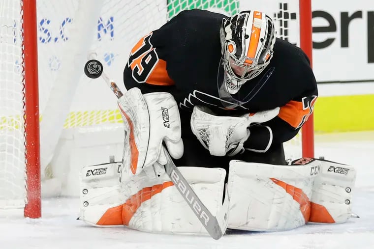 Flyers goaltender Carter Hart stopping the puck against the Red Wings on Saturday. He is 10-1 in his last 11 starts.