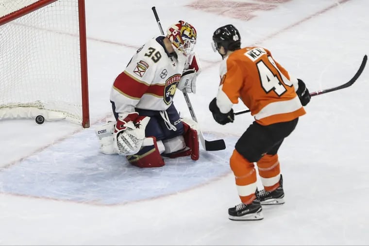 Jordan Weal puts a shot through the legs of Florida goalie Michael Hutchinson during Tuesday's shootout at the Wells Fargo Center. It proved to be the winning goal.