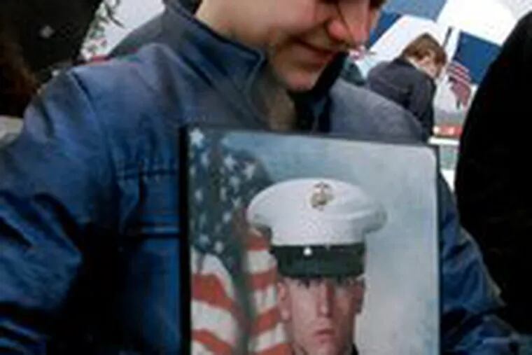 Four years ago in a steady rain, Jen Dunckley held a portrait of her husband, Allen James Dunckley Jr., at a support rally in Feasterville, Bucks County, during his first tour of duty in Iraq.