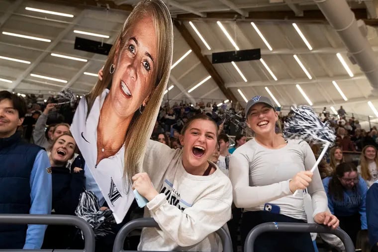 Villanova students and fans, holding a cutout of coach Denise Dillon, hope the team's NCAA run continues to the Sweet 16.