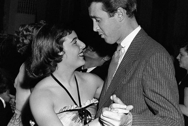 In this April 1, 1943 photo, movie star Jimmy Stewart dances with Mary Rodgers at the "Oklahoma!" fifth birthday party at the Plaza in New York. Rodgers, the daughter of Broadway icon Richard Rodgers, who found her own fame as composer of the 1959 musical "Once Upon a Mattress" and as the author of the book "Freaky Friday," has died. She was 83.
