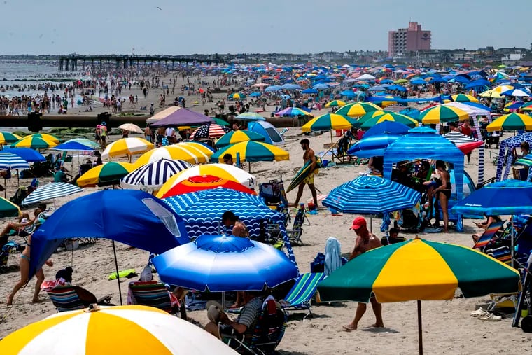 The beach is a sea of umbrellas in Ocean City, N.J., on July 3, 2023 for the Independence Day holiday weekend.
