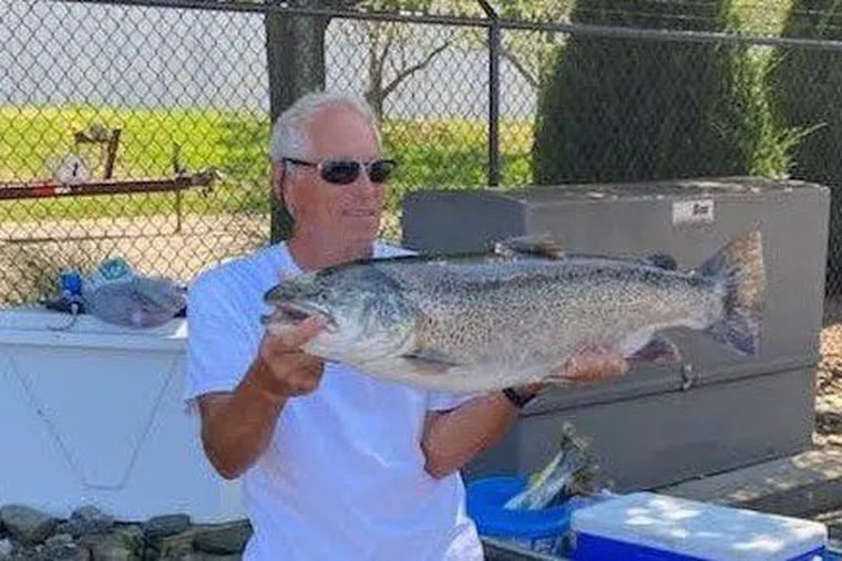 Robert Ferraro, 68, holds the record brown trout for Pennsylvania he caught in Lake Erie on Aug. 8, 2020.