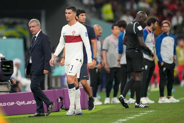 Portugal manager Fernando Santos (left) wasn't happy with how Cristiano Ronaldo (center) left the game against South Korea when he was subbed out.