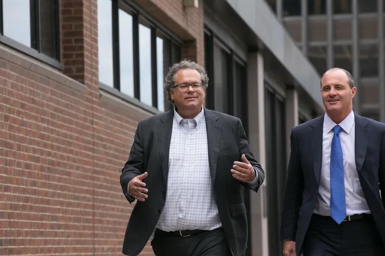 Ken Smukler, a political strategist for U.S. Rep. Bob Brady, and his lawyer Brian McMonagle, right, exit Federal Court, after an arraignment in 2017.