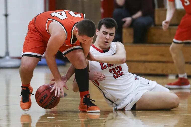 Cherry Hill East's Sam Serata and Cherokee's Tyler Ludwikowski fight for a loose ball during the second quarter.