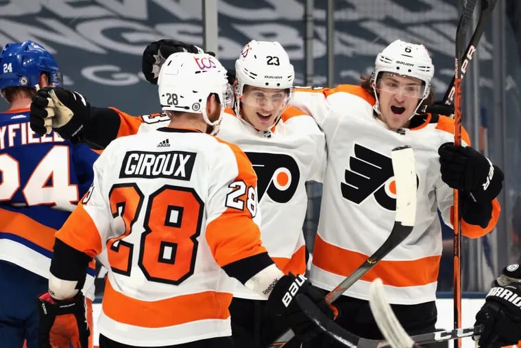 The Flyers' Oskar Lindblom (23) celebrates his late goal with his teammates Thursday, lifting Philly to a 4-3 win over the host New York Islanders.