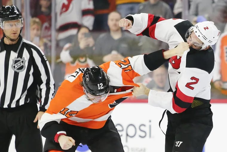 Scenes like this — Michael Raffl and New Jersey's John Moore in a fight last season — did not take place in the Flyers' first 18 games. They entered Thursday one of two NHL teams without a fight this season.