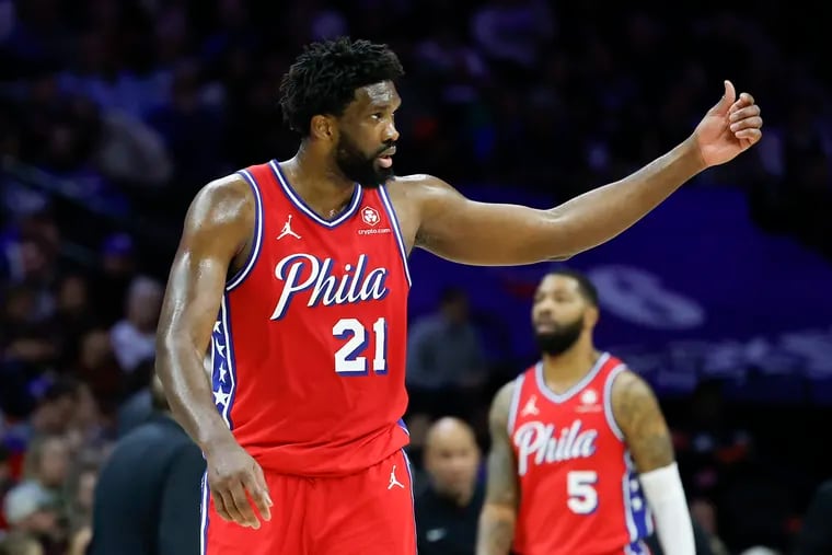 Sixers center Joel Embiid raises his thumb to a game official at the end of the third quarter against the New York Knicks on Friday, January 5, 2024 in Philadelphia.