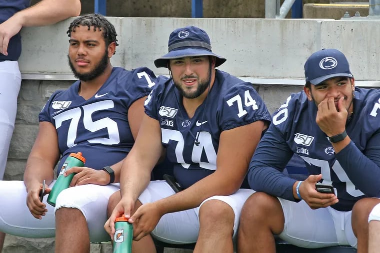 Penn State offensive linemen Des Holmes (75), Steven Gonzalez (74) and Juice Scruggs (70) during the program's annual Media Day on Aug. 3.