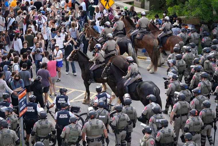 State troopers try to break up a pro-Palestinian protest at the University of Texas on Wednesday in Austin, Texas.