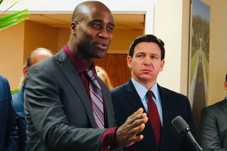 Florida Surgeon General Joseph Ladapo and Gov. Ron DeSantis at a news conference in West Palm Beach, Fla., on Thursday, Jan. 6, 2022.
