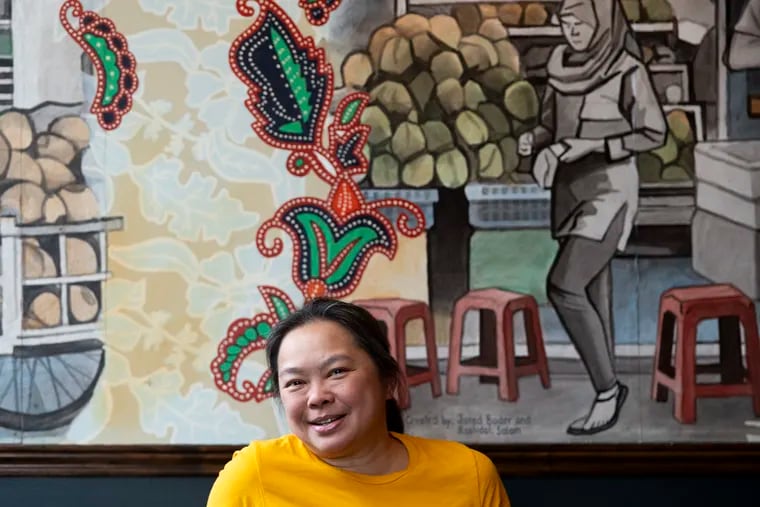 Chef Ange Branca at her new restaurant, Kampar. Parts of the mural were salvaged from Branca’s previous restaurant, Sate Kampar.