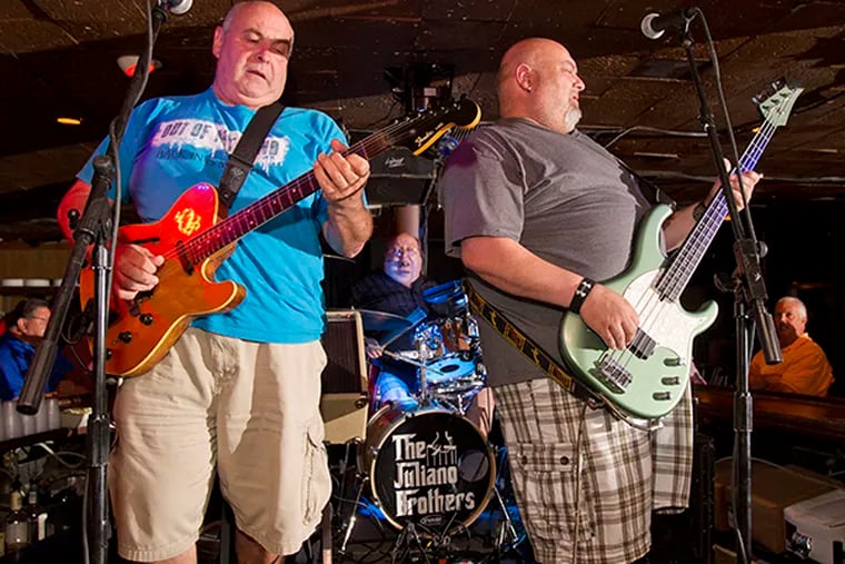 Matt, Mike, and Greg Juliano perform at the Springfield Inn in Sea Isle City on June 30, 2015. (CHARLES FOX/Staff Photographer)