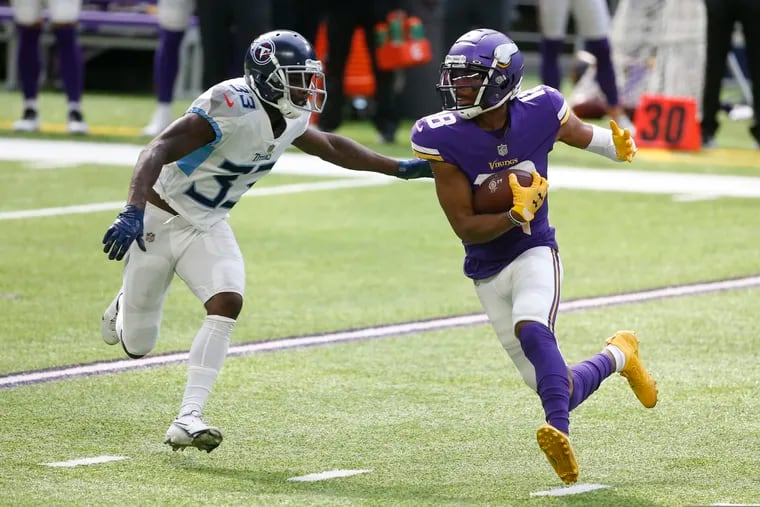 Vikings wide receiver Justin Jefferson runs from Titans cornerback Johnathan Joseph with one of his seven catches on the day. Despite Jefferson's big day (175 yards), the Titans rallied to win it on a late 55-yard field goal.