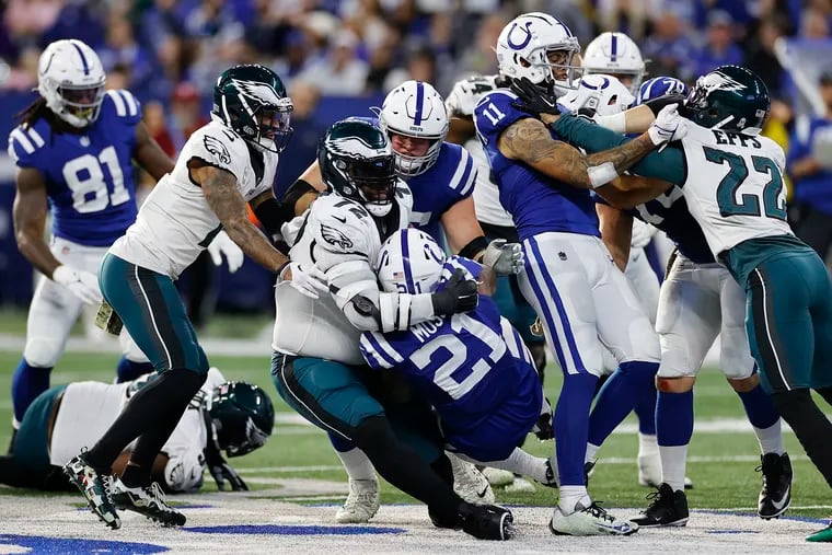 Eagles defensive tackle Linval Joseph stops Indianapolis Colts running back Zack Moss in the third quarter on Sunday in Indianapolis.