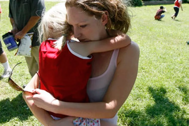 Emily Lanzisera, 6, hugs her birth mother, Lola Henry , as they say goodbye at the annual picnic sponsoredby Adoptions from the Heart. The picnic celebrates relationships of adoptive families with birth parents.