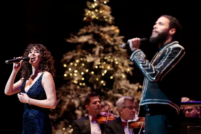 Vocalists Mandy Gonzalez (left) and Jordan Donica performing at Philly Pops Christmas Spectacular Saturday afternoon in Verizon Hall.