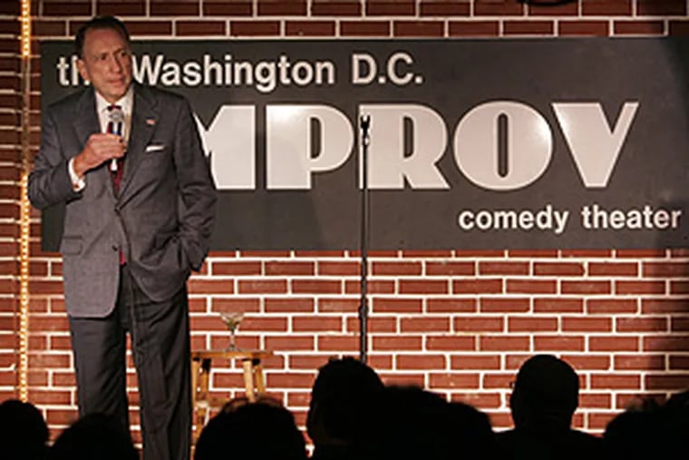 Sen. Specter delivers a comedy routine at the DC. Improv
as part of a benefit program in Washington last night.
