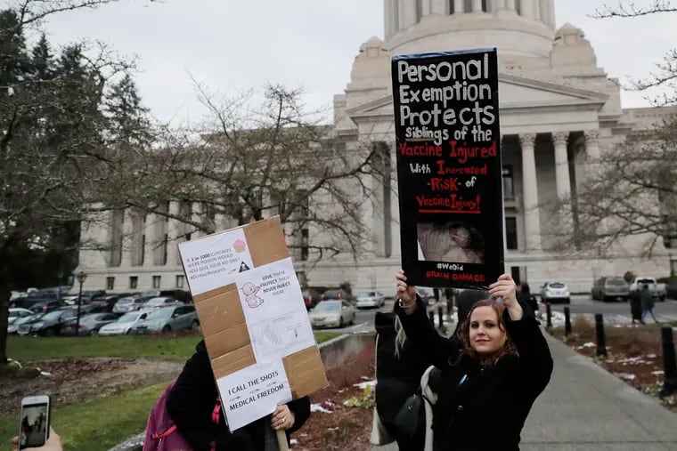 To a pediatrician who remembers the days before the measles-mumps-rubella vaccine, protesters like this, shown in Olympia, Wash., are inexplicable at best, dangerous at worst. (AP Photo/Ted S. Warren)