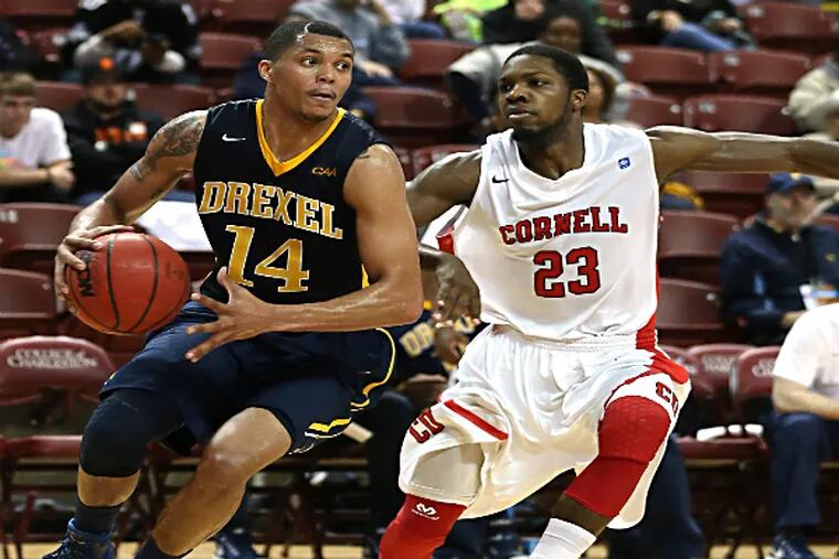 Drexel guard Damion Lee dribbles to the basket with pressure from Cornell Big Red guard Galal Cancer. (Jim Dedmon/USA TODAY Sports)