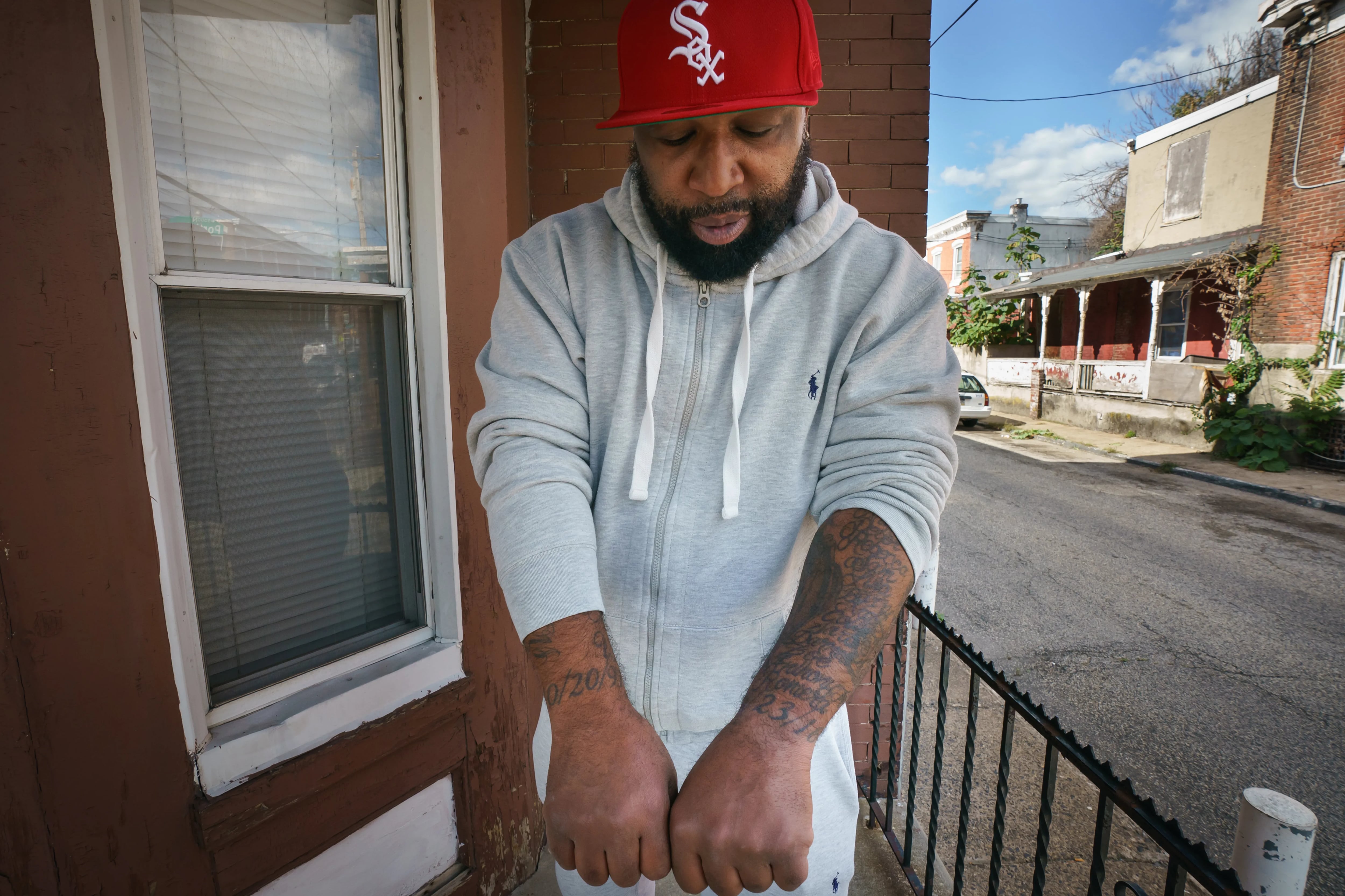 THE CASE THAT COLLAPSED Visiting his grandmother's house in Germantown, Anthony Wright displays his tattoos, which are an inked map of his journey through the criminal legal system. 