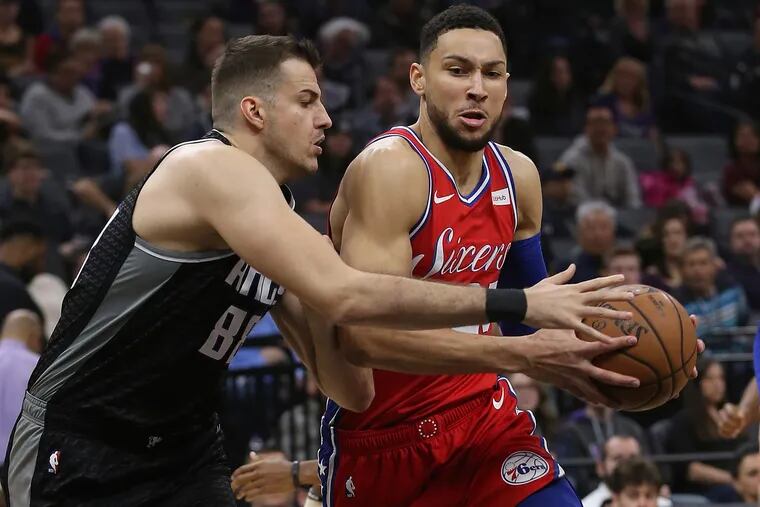 Philadelphia 76ers guard Ben Simmons, right, drives to the basket against Sacramento Kings forward Nemanja Bjelica, left, during the first quarter of an NBA basketball game Saturday, Feb. 2, 2019, in Sacramento, Calif. (AP Photo/Rich Pedroncelli)
