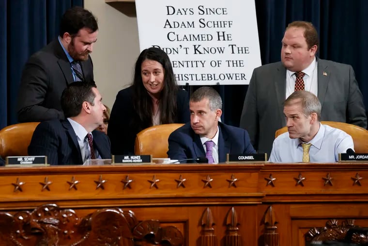 Rep. Devin Nunes (R-Calif),  the ranking member of the House Intelligence Committee, (left) confers with Steve Castor, the Republican staff attorney (lower center) and Rep. Jim Jordan (R., Ohio, lower right) and other staff aides, after Deputy Assistant Secretary of Defense Laura Cooper and State Department official David Hal, testified before the House Intelligence Committee on Capitol Hill in Washington on Wednesday.