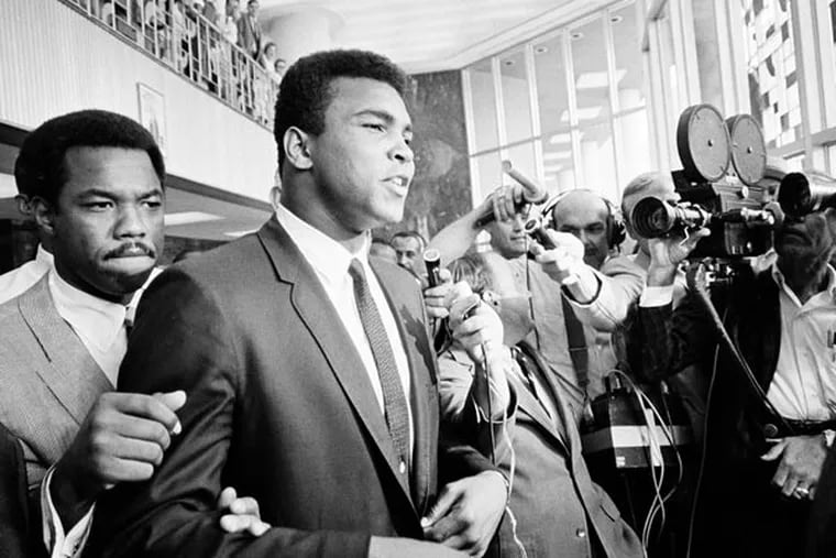 Heavyweight boxing champion Muhammad Ali has a "no comment" as he is confronted by newsmen as he leaves the Federal Building in Houston during a recess in his trial for refusing induction to the army. Barely past the opening credits of a new documentary about Ali, we get a glimpse of how many Americans felt about him during a tumultuous time in the country's history. (AP Photo/Ed Kolenovsky, File)
