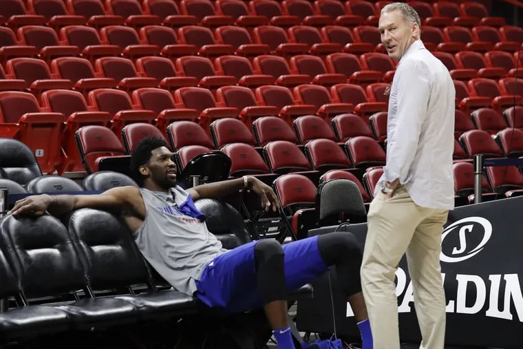 Philadelphia 76ers center Joel Embiid with former team president of basketball operations Bryan Colangelo before a practice in Miami this past April.