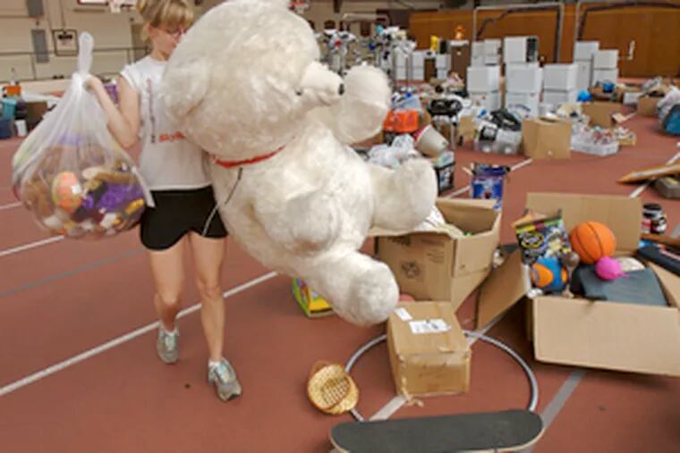 A teddy bear bigger than Brianne Gallagher is among the items to be offered today at Swarthmore College&#0039;s first Trash 2 Treasure sale.