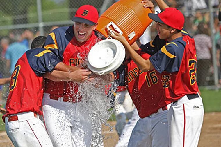 Frankford players douse one of their coaches with water after defeating GAMP. (Michael Bryant/Staff Photographer)