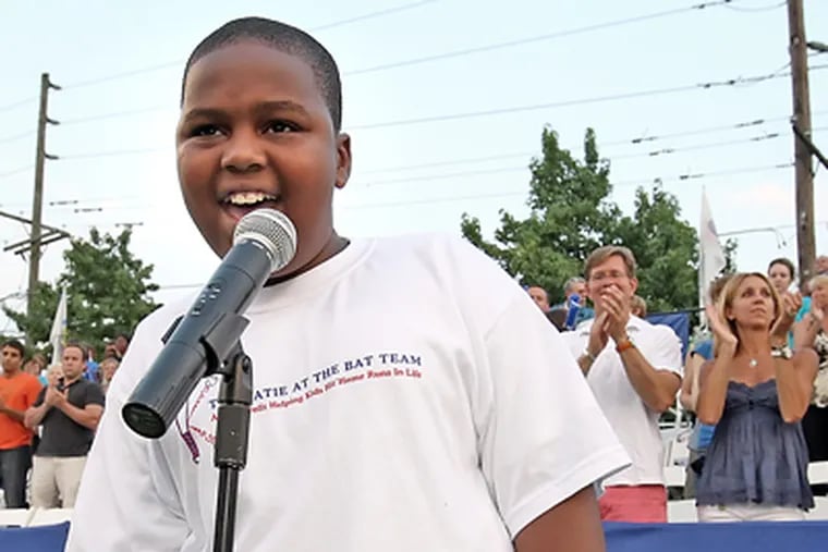Michael Woodard sings the National Anthem before the Philadelphia Freedom’s tennis matches last night at King of Prussia. He’ll sing at the U.S. Open in Flushing, N.Y. (Steven M. Falk / Staff Photographer)