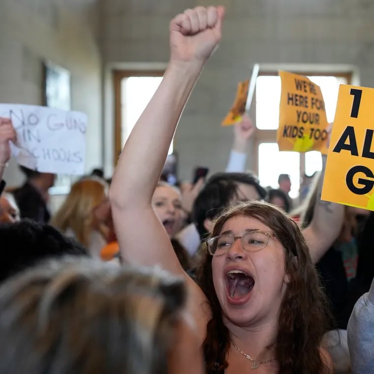 Emmie Wolf-Dubin, center, yells during a protest outside the House chamber after legislation passed that would allow some teachers to be armed in schools during a legislative session on Tuesday in Nashville, Tenn.