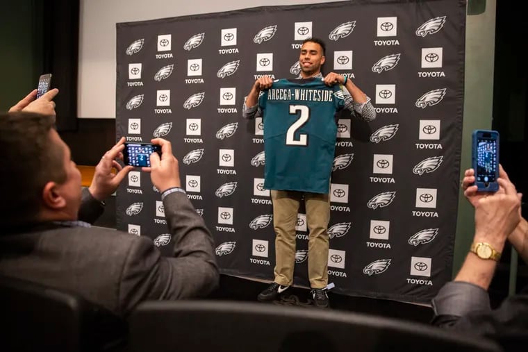 J.J. Arcega-Whiteside poses for a photo with his new Eagles jersey on Saturday.