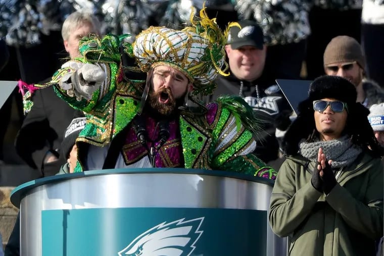 Dressed in Mummers attire, Eagles center Jason Kelce pauses during his colorful speech on the Art Museum steps.