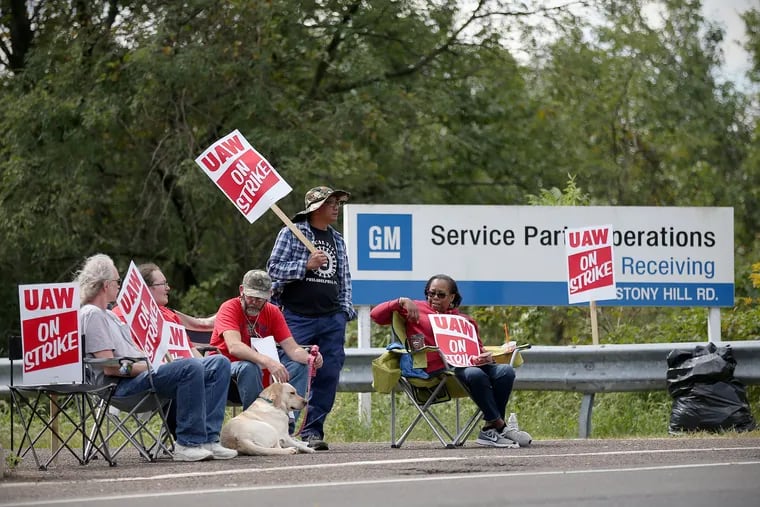 Workers (from left) George Muller, Kelly McKinnon, Mike Jones, Clarence Natividad, and Robin Pinkney picket outside the General Motors parts facility in Langhorne, Pa., on Wednesday, Sept. 18, 2019. The strike is likely to end Friday night.