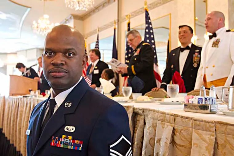 (foreground) Shawn Forman, Air Force, retired Master Sgt., aerospace science instructor at Camden County Technical School, at the 2013 Annual High School Enlistee Recognition Ceremony at The Mansion in Voorhees, May 21, 2013 ( DAVID M WARREN / Staff Photographer )