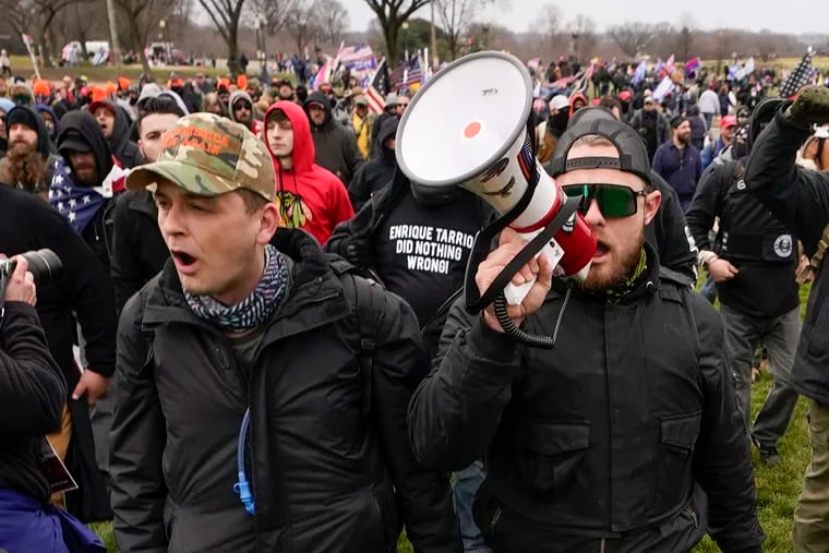 Philadelphia Proud Boys president Zachary Rehl (left) and Ethan Nordean, another leader of the group, march toward the U.S. Capitol in Washington, in support of President Donald Trump on Jan. 6, 2021.
