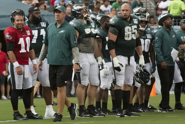 Doug Pederson (third from left) on sideline during Sunday's practice at the Linc.